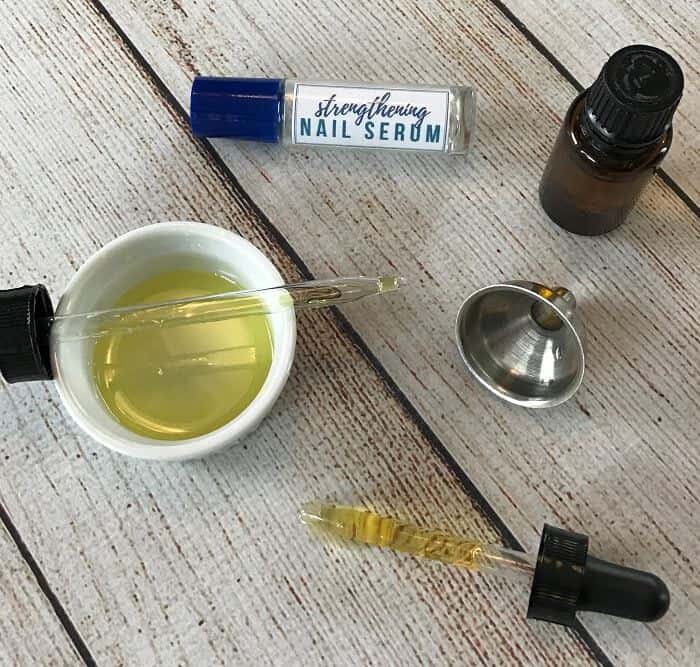 DIY essential oil nail serum for dry, weak, brittle fingernails. Nourishes, strengthens, stimulates healthy nail growth. And it restores moisture to make nails more flexible and resilient. #essentialoils #essentialoilrecipes #nailserum #naturalDIY #essentialoilserum #rollerbottlerecipes #easyDIY #naturalbeauty